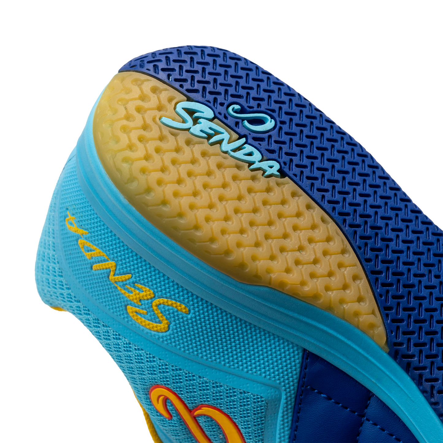 Close-up heel view of Blue Ushuaia Club 2.0 Futsal Shoes by Senda – Textured gum rubber outsole with Senda branding and heel grip pattern for stability, traction, and non-slip performance on indoor futsal courts.