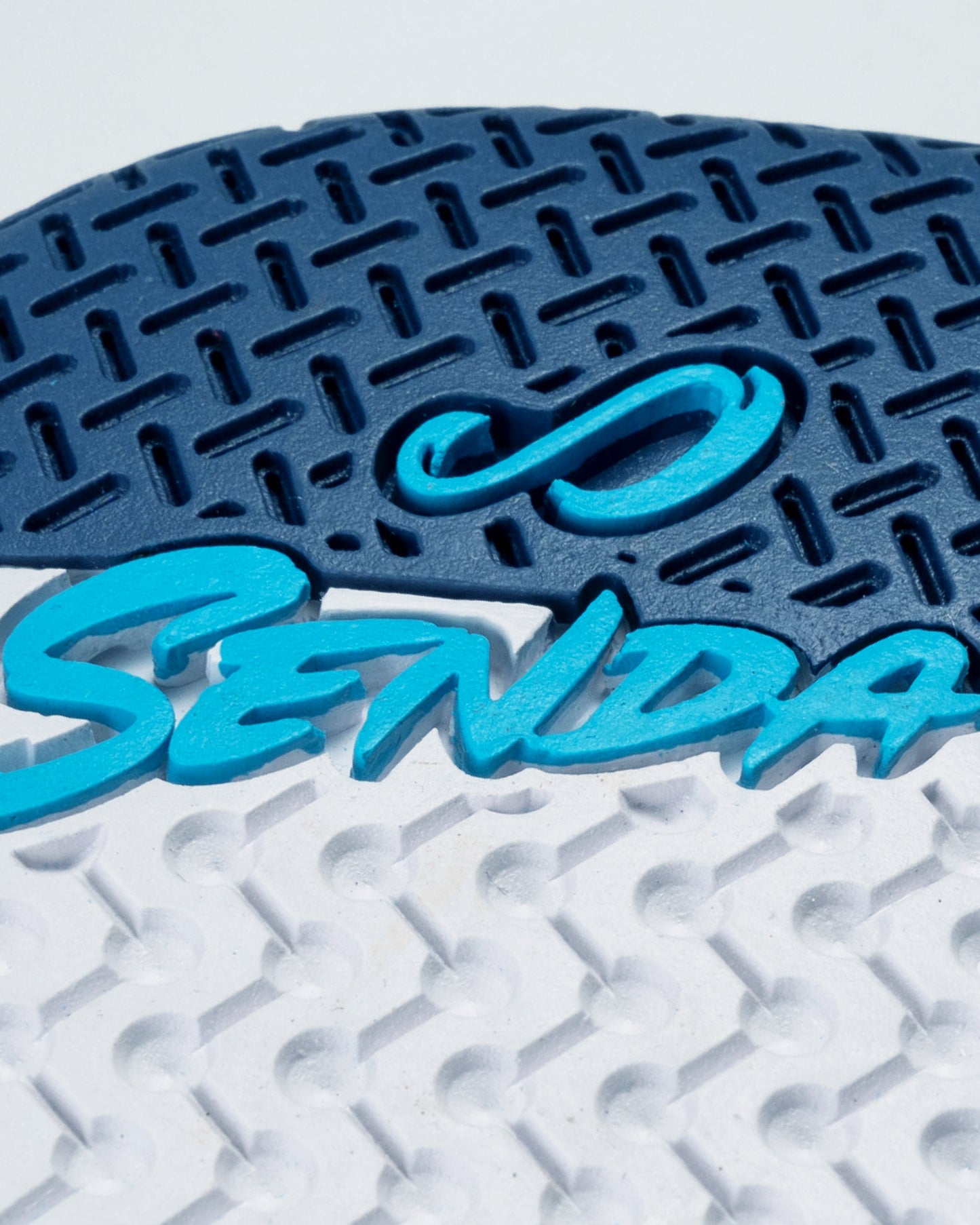 Close-up of Senda branding on the outsole of the Ushuaia Pro 2.0 futsal shoe, highlighting dual-tone traction pattern for superior indoor grip and control.