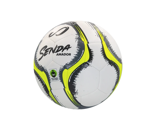 Angled side view of Senda Amador Training Soccer Ball showcasing dynamic black and yellow brushstroke graphics and Fair Trade Certified badge.