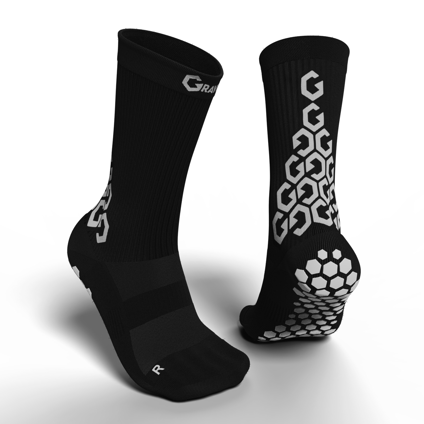 Black Senda Gravity Pro Crew Socks showing front and back design with grip tech sole and hexagonal anti-slip pattern.