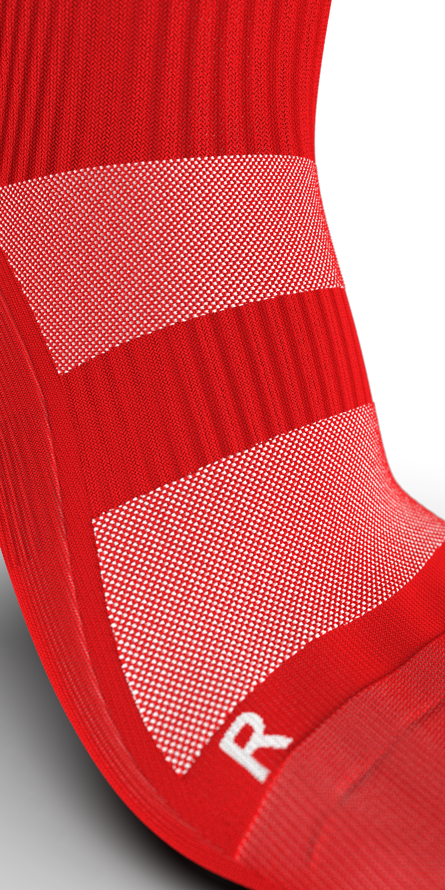 Close-up of red Gravity Pro crew sock highlighting breathable mesh and targeted compression around the arch and ankle.