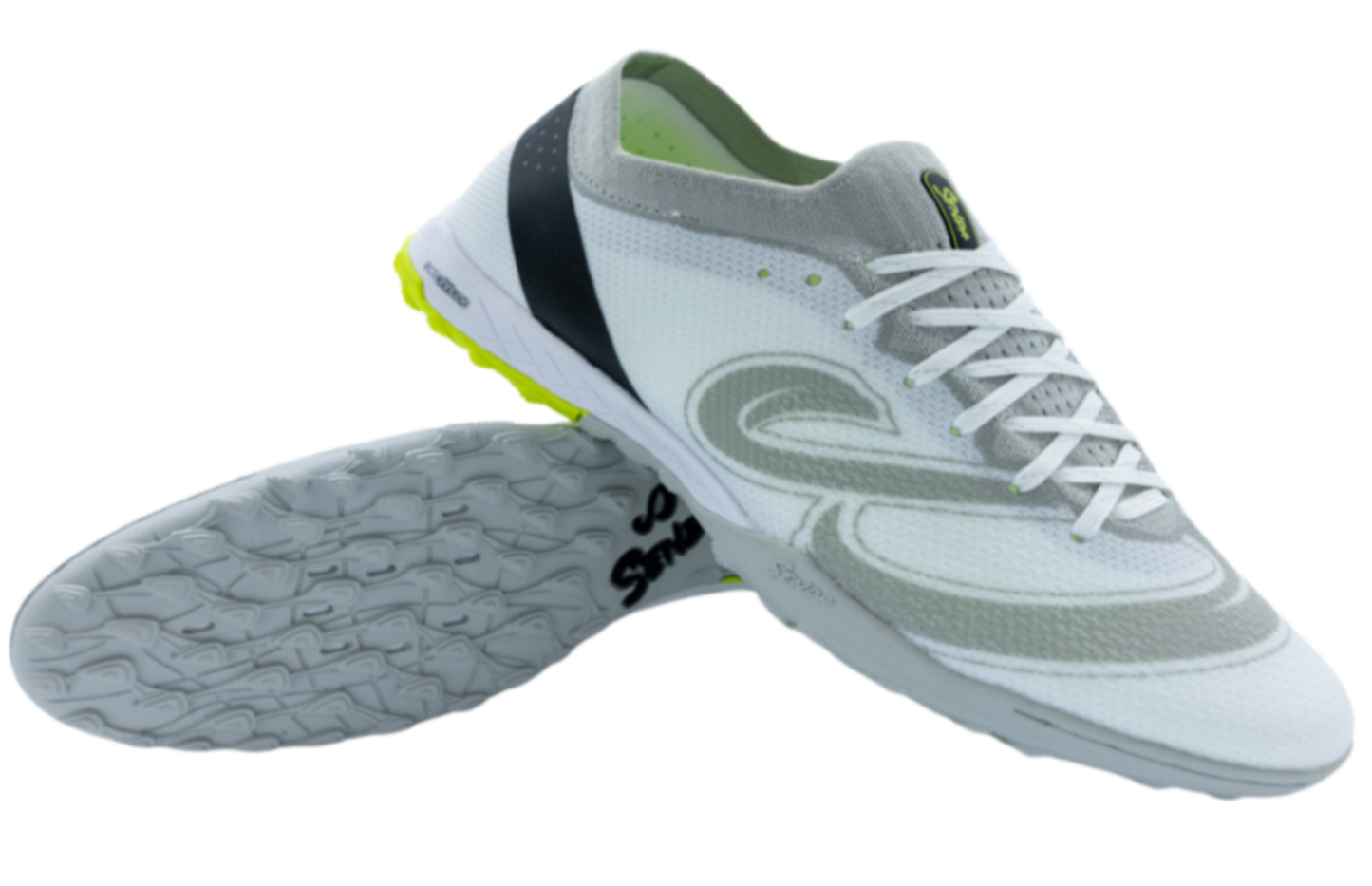 Senda Pampa Pro Turf soccer shoes in white and grey shown from side and sole angle, featuring hybrid-stud outsole and breathable knit upper.