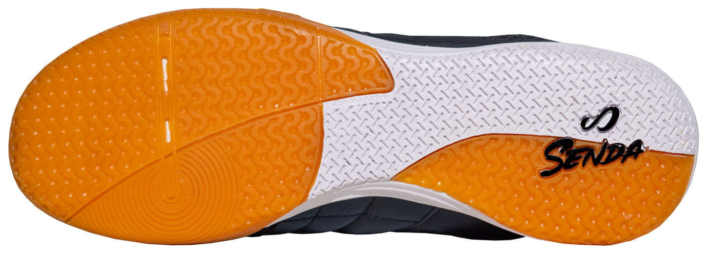 Sole view of Black Ushuaia Club 2.0 Futsal Shoes by Senda – Non-marking gum rubber outsole with Senda branding and dual-texture traction zones for grip, stability, and fast directional changes on indoor futsal courts.

