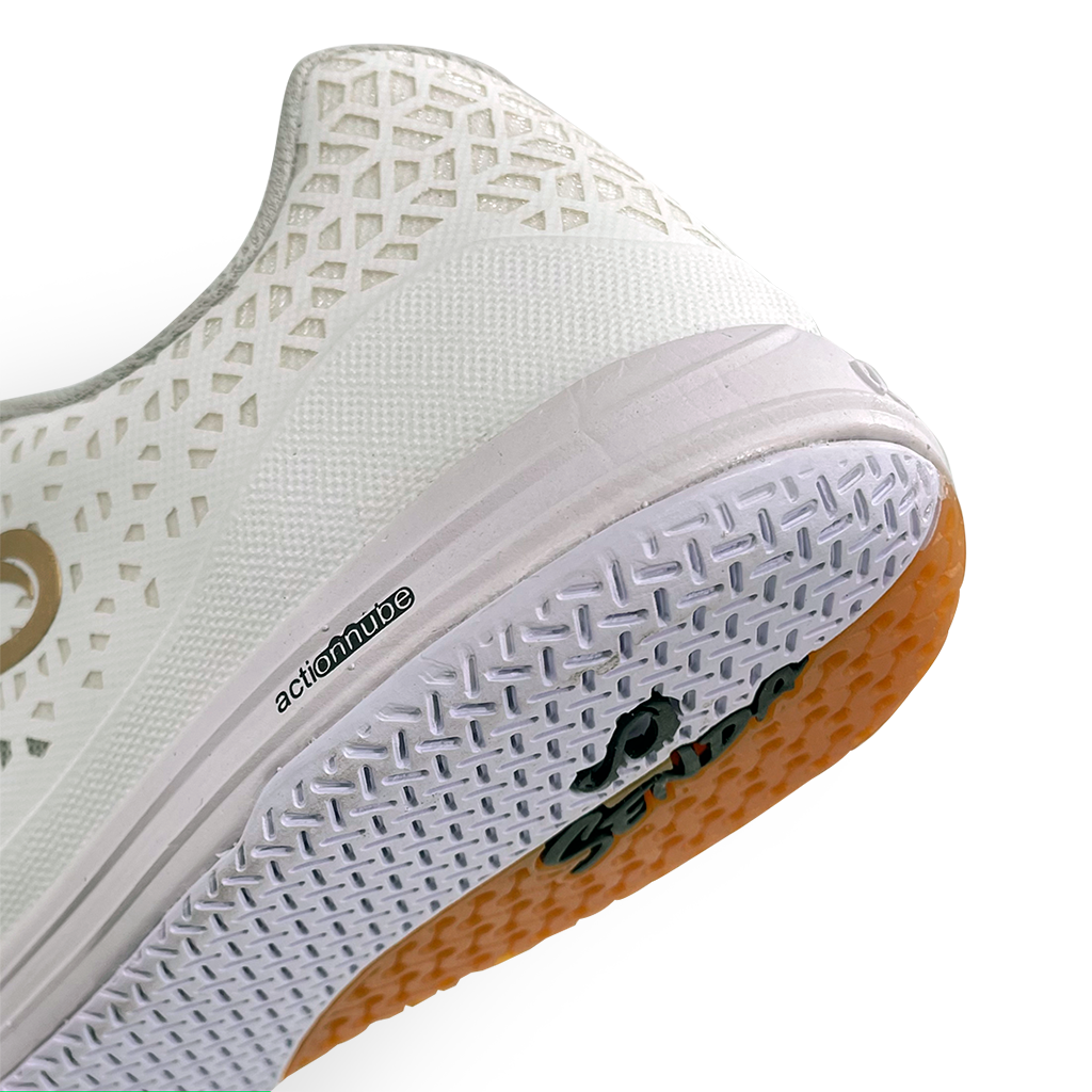 Close-up of Senda Ushuaia Pro 2.0 White Gold heel showing textured outsole grip, Actionnube cushioning, and breathable geometric mesh pattern.

