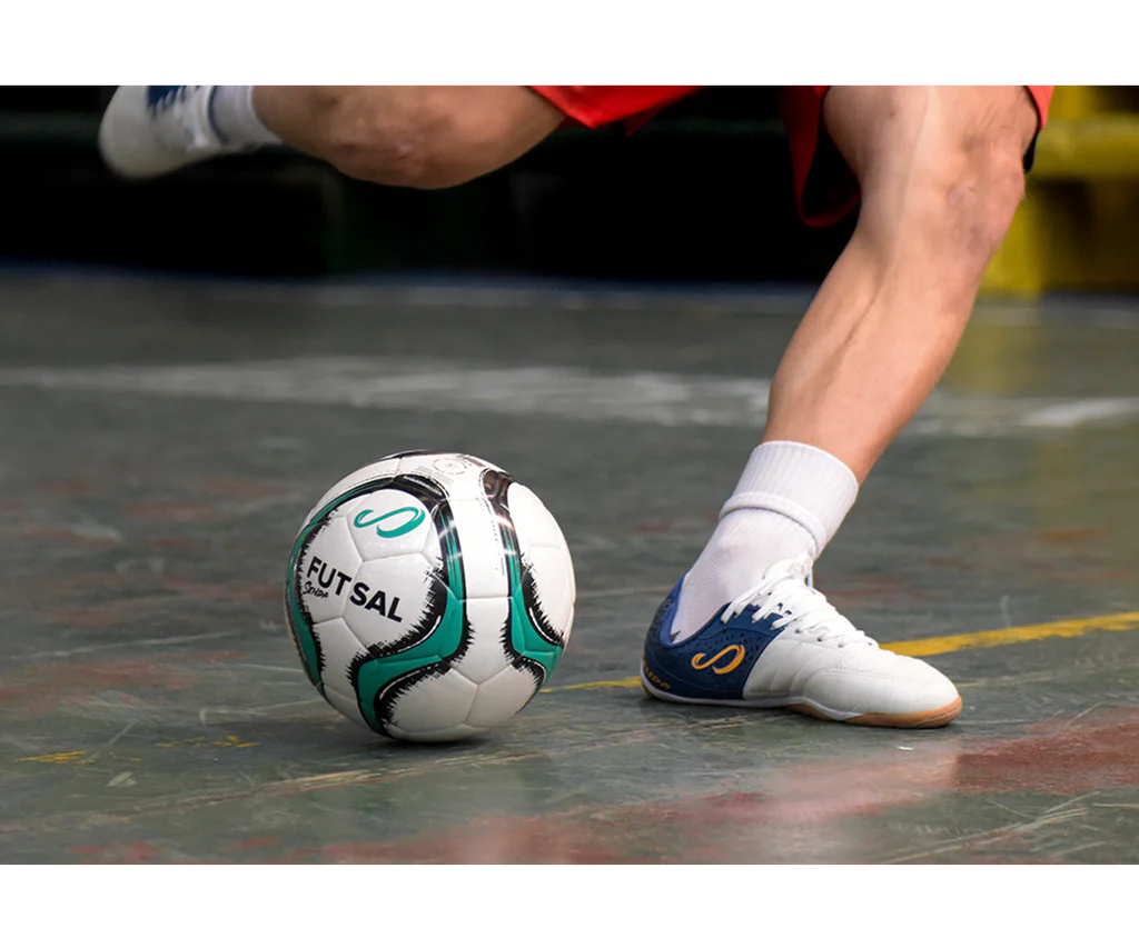 Senda Bahia Professional Futsal Ball in motion during an indoor game, showing close-up action and court-ready performance.

