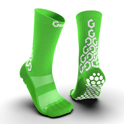 Bright green Senda Gravity Pro Crew Length Socks featuring hexagonal grip traction and white Gravity logo on both front and back view.

