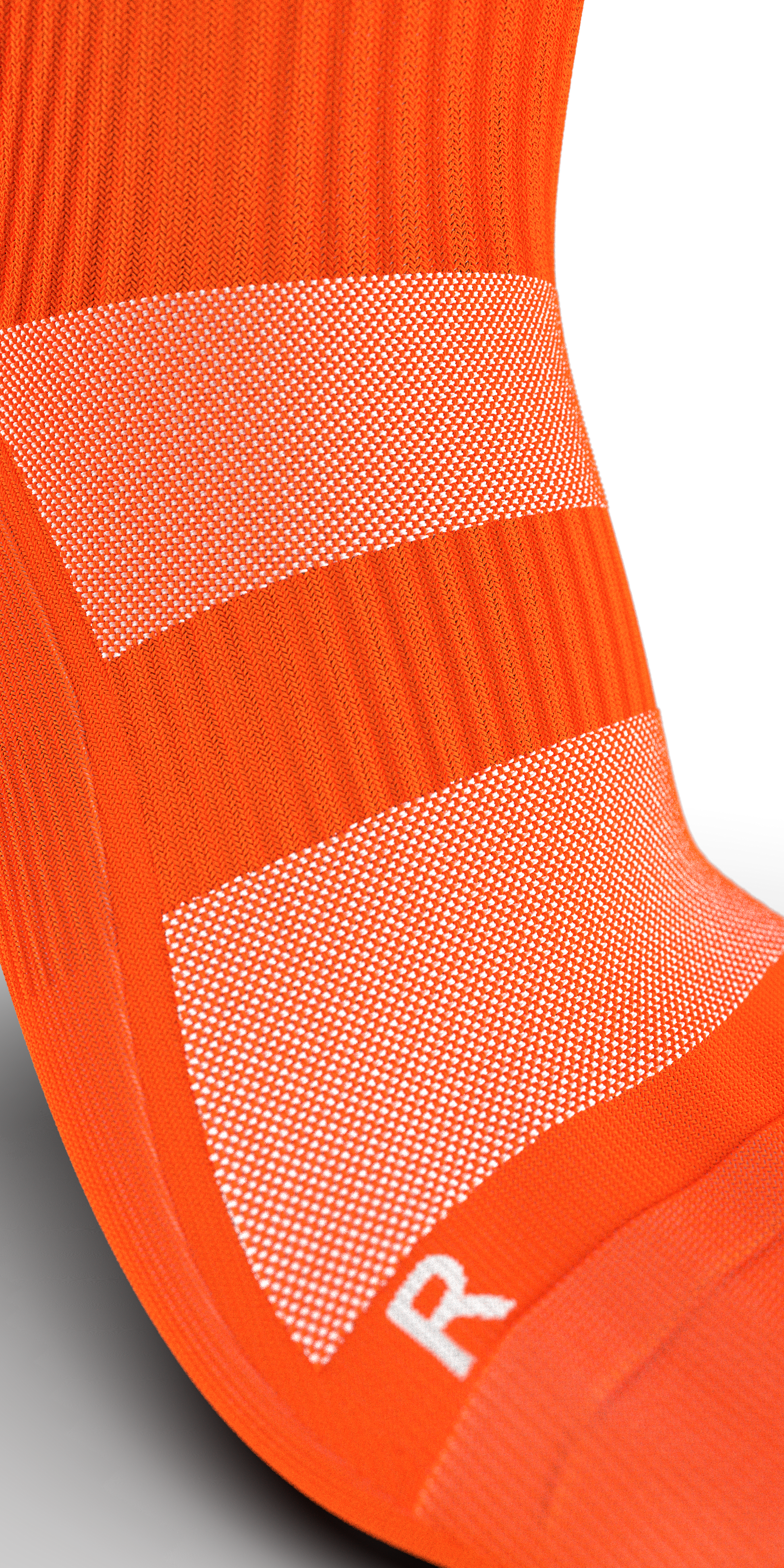Close-up of Senda Gravity Pro orange sock showing mesh ventilation and arch compression for enhanced fit.

