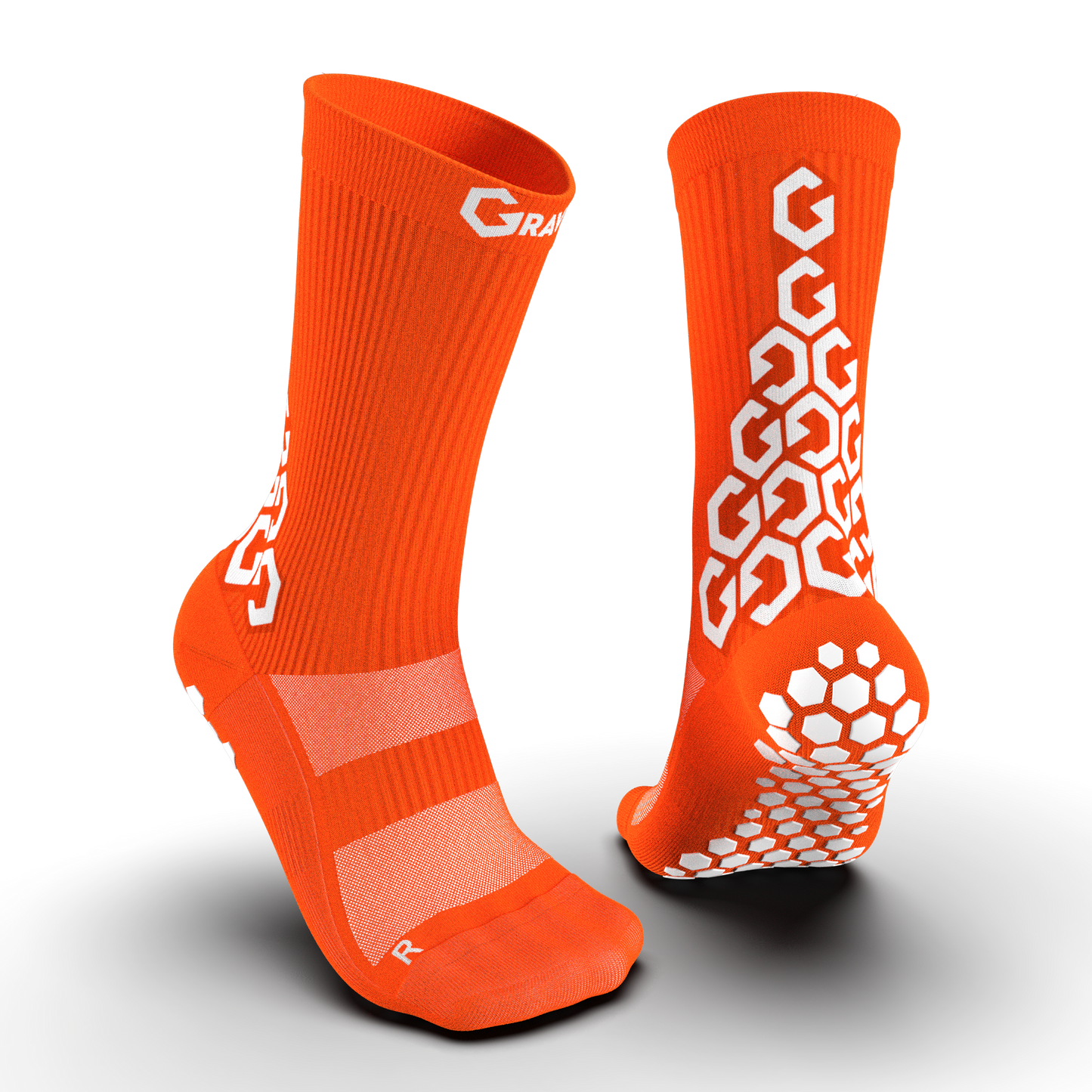Vibrant orange Senda Gravity Pro Crew Socks with anti-slip white grip pads and geometric logo detailing front and back.

