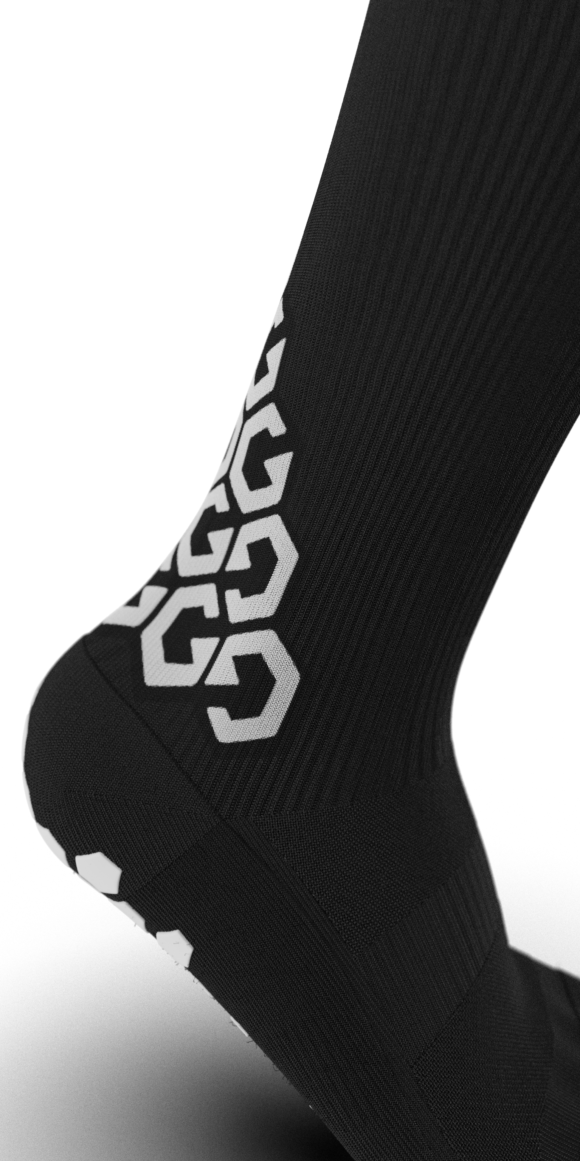 Side angle of Senda Gravity Pro Grip Socks in black featuring bold G-pattern branding and ribbed compression zones for snug arch support and mobility.

