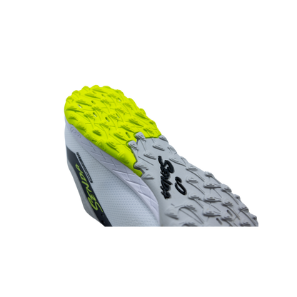 Rear angled view of Senda Pampa Pro Turf shoe highlighting aggressive heel traction lugs and durable rubber outsole for turf grip.

