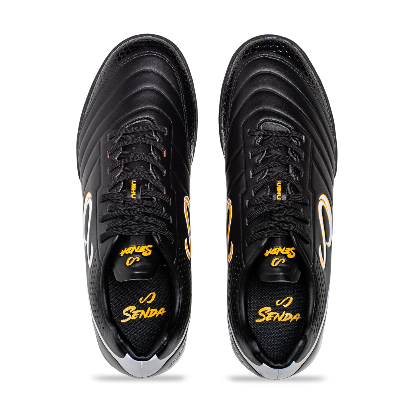 Top view of Senda Ushuaia Academy Turf Black showing lace-up closure, padded collar, and insole branding.

