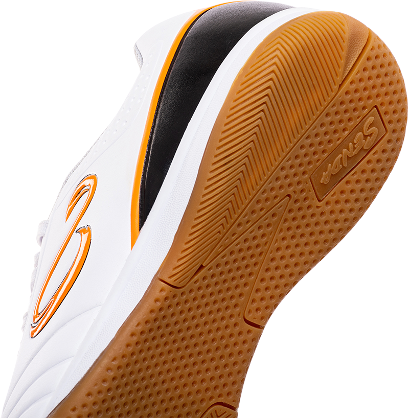 Close-up of the gum rubber outsole on Senda Ushuaia Academy White futsal shoe, showing traction detail and logo branding.

