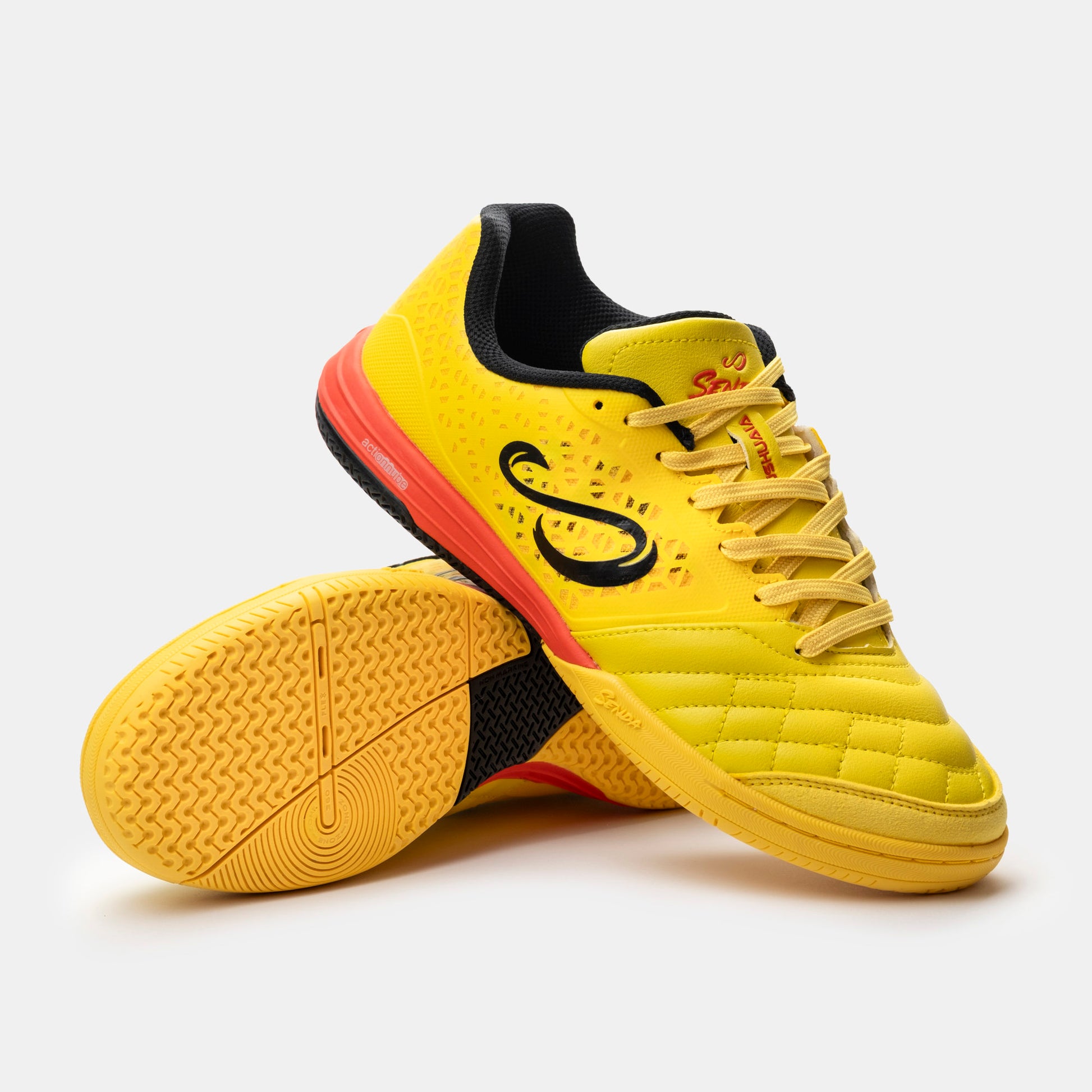 Senda Ushuaia Pro 2.0 indoor futsal shoes in yellow with gum rubber sole and black logo, shown side and outsole view for traction details.

