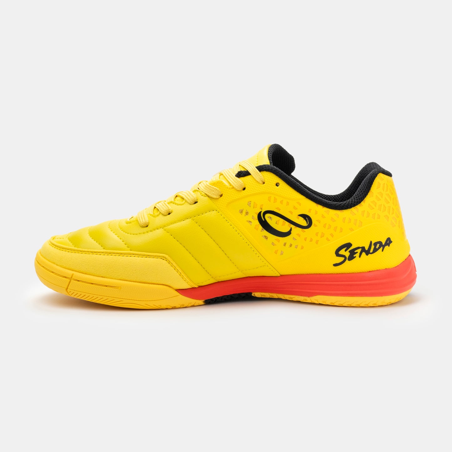 Medial view of Senda Ushuaia Pro 2.0 yellow indoor soccer shoes with stitched forefoot and bold heel branding.

