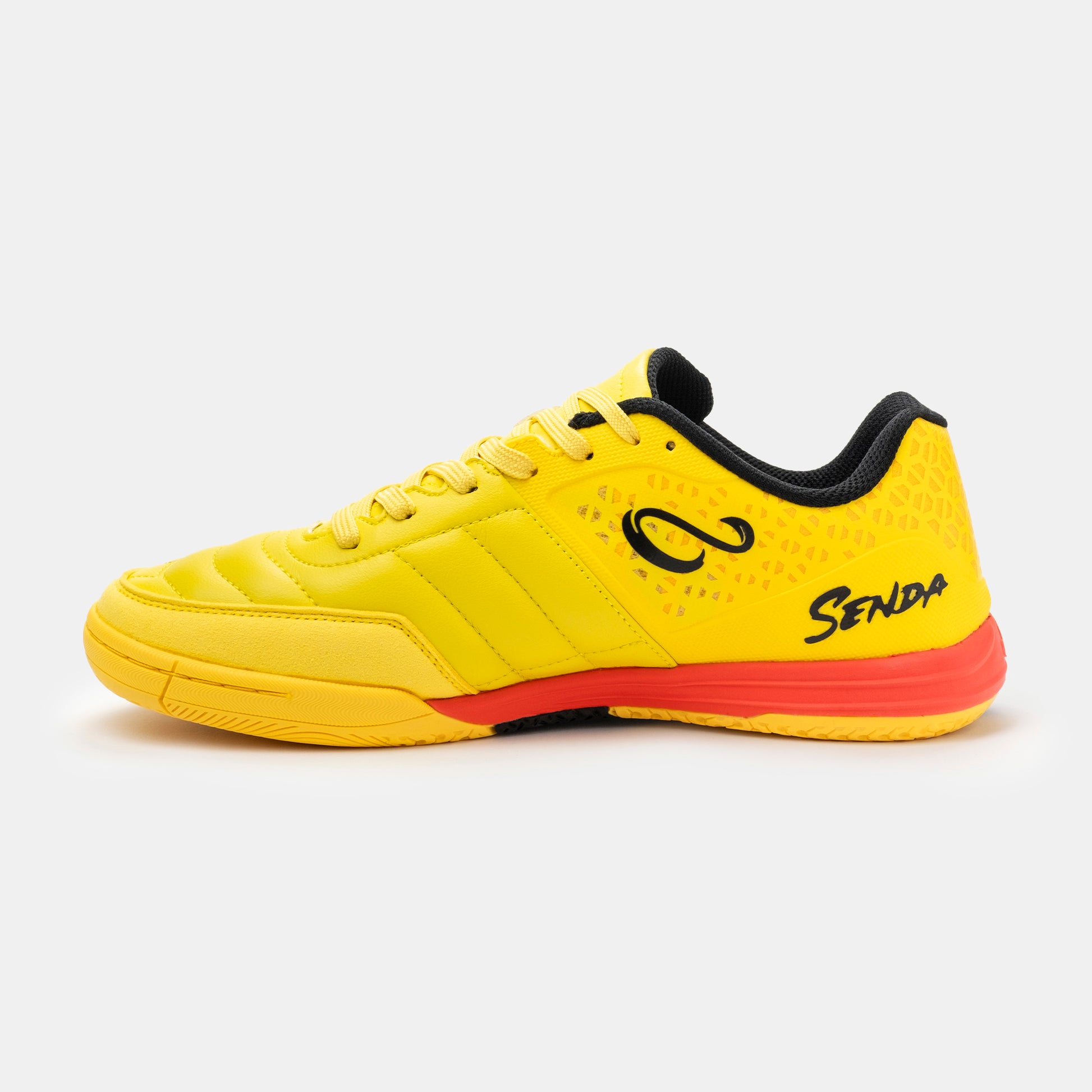 Medial view of Senda Ushuaia Pro 2.0 yellow indoor soccer shoes with stitched forefoot and bold heel branding.

