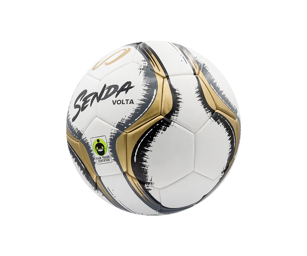 Angled side view of Senda Volta soccer ball showing textured gold panels, dynamic black graphic design, and Fair Trade Certified stamp.

